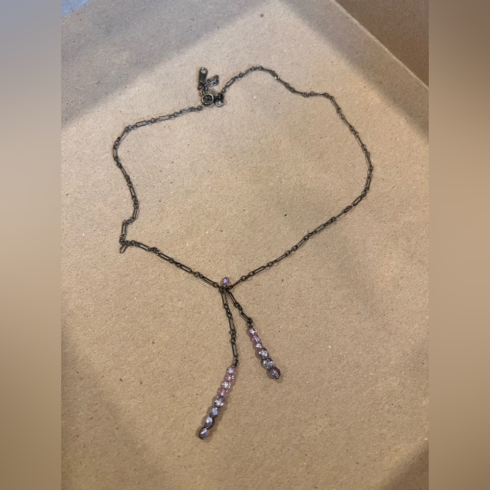 Choker necklace with purple stones.